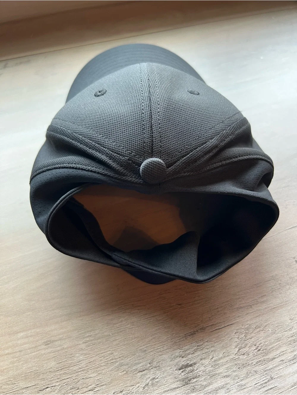 Ladies Under Armour Ponytail Black Cap with White Embroidered Logo